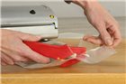 Safety cutter for plastic bags and vacuum bags